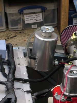 Header Tank Bracket onto the Chassis (another strap is not visible but connects to the vertical face)