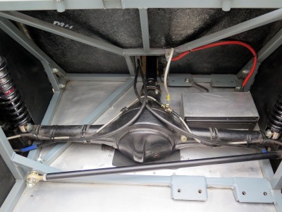 Rear axle, showing cut out in the floor and re-routed handbrake cables (I have disc brakes at the rear) now running over the axle